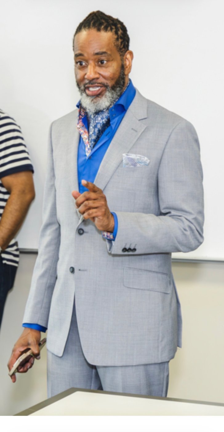 Eugene Lewis speaking to a group